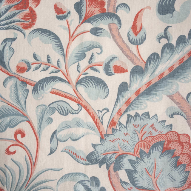 Large scrolling floral fabric in pale duck egg blue and coral on a light ground