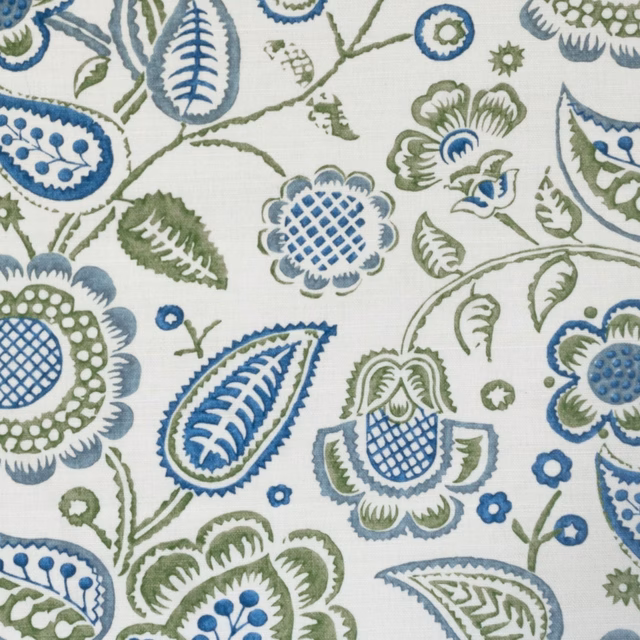 Blue and sage botanical print on an off-white woven ground