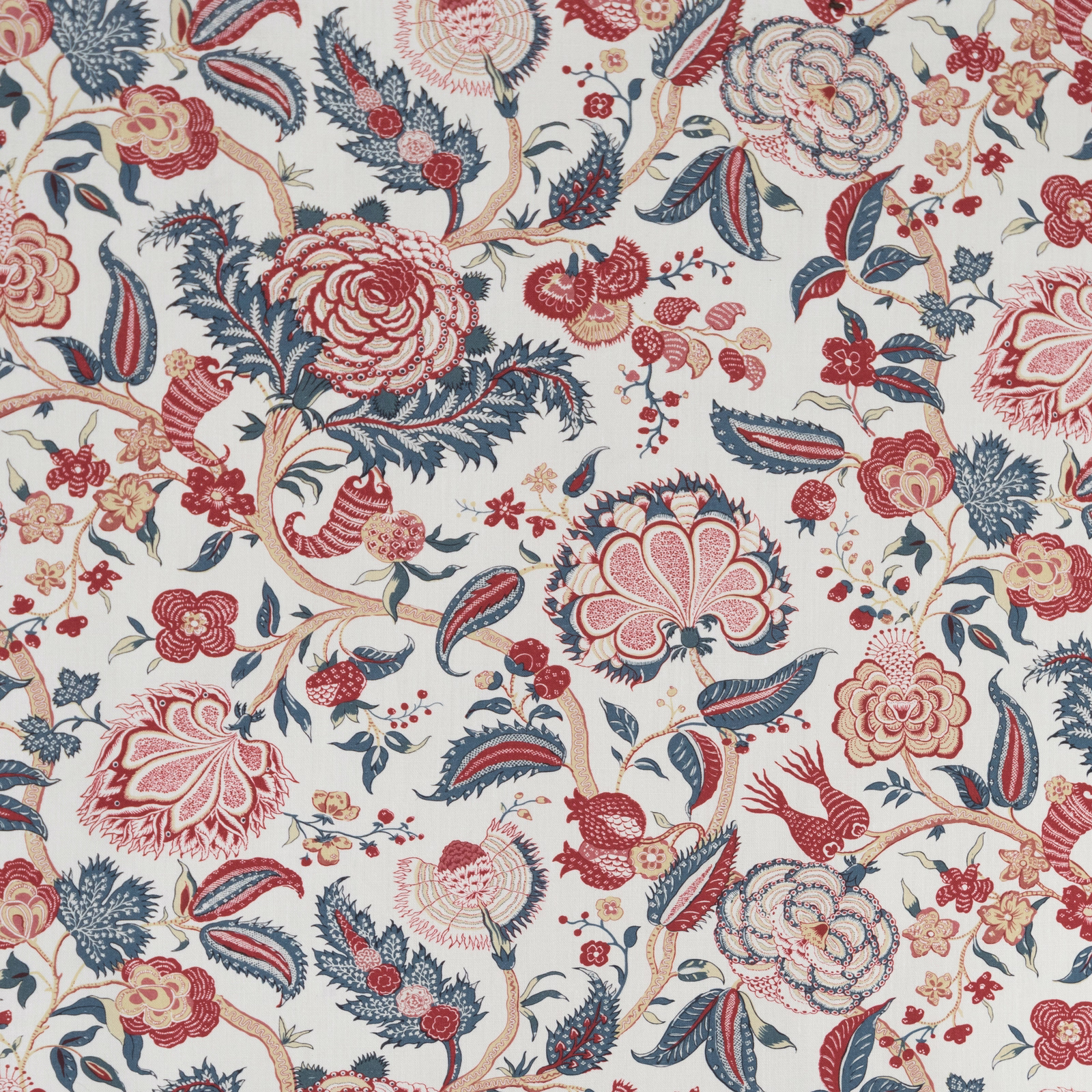 Ivory floral fabric with red blooms, blue foliage and scrolling stems