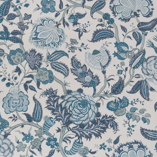 Large-scale teal and slate blue floral print on an ivory fabric ground