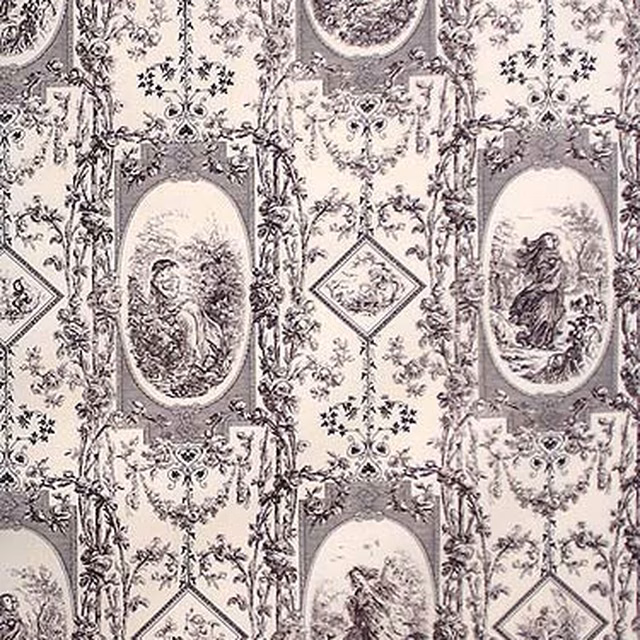 Charcoal grey toile fabric with oval scenes, diamond motifs and leafy scrolls