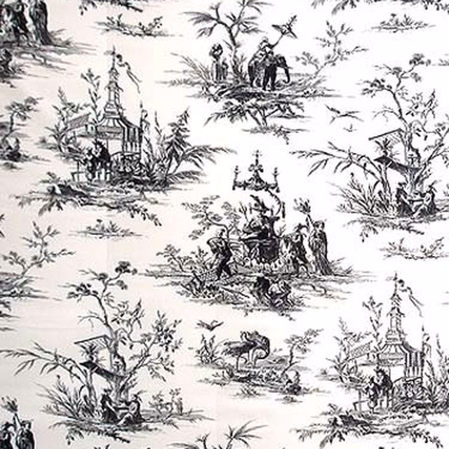 Black charcoal scenic toile pattern on a pale fabric ground