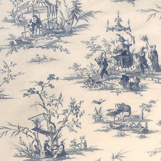 Blue toile fabric with pastoral scenes on a pale cream ground