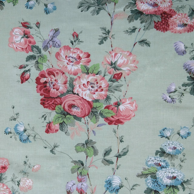 Pistachio green floral fabric with pink, lilac and blue blossoms