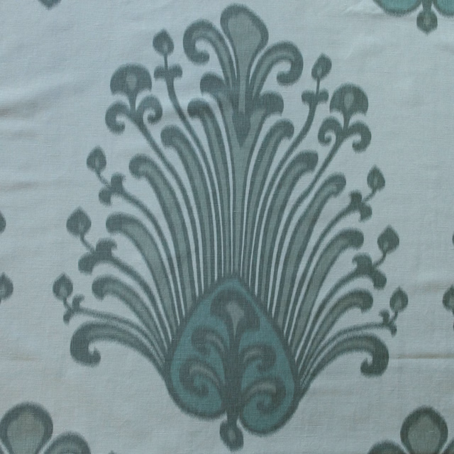 Large teal damask motif on a pale linden ground with soft printed edges