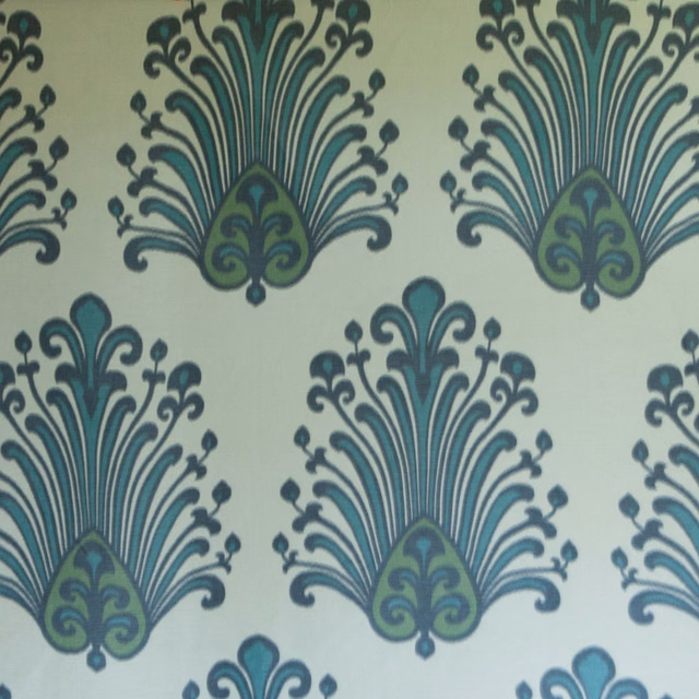 Large teal and sage damask motifs on a pale lichen ground