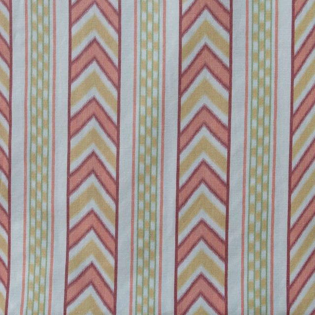 Coral pink and yellow chevron stripes with narrow green check bands on pale ground