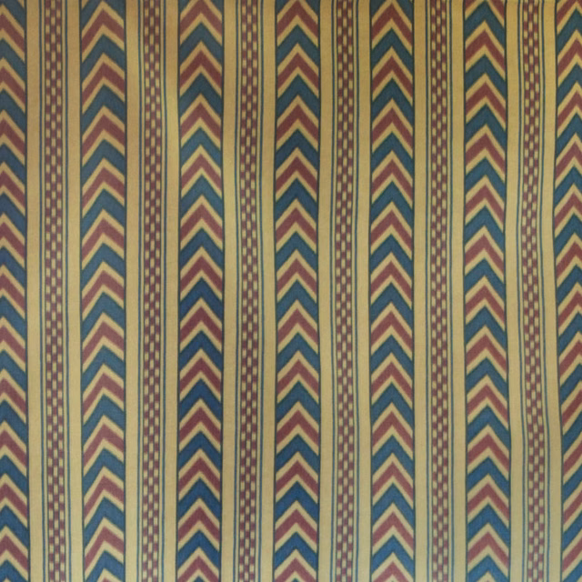 Vertical chevron stripes in prussian blue, bordeaux and gold on a muted ground