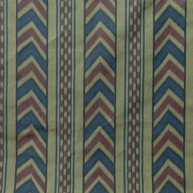 Vertical striped fabric with prussian blue chevrons and bordeaux accents on a pale ground