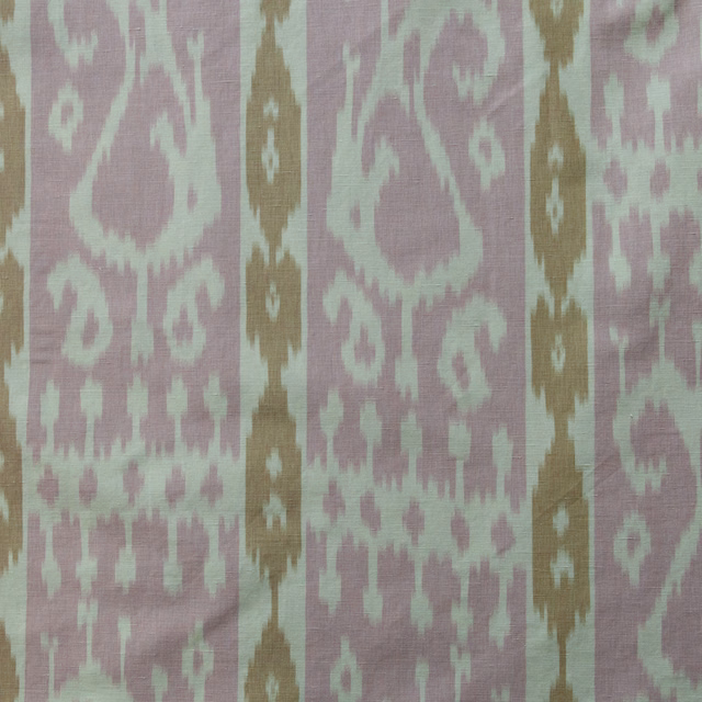Dusty rose woven fabric with ochre vertical stripes and pale ikat paisley motifs