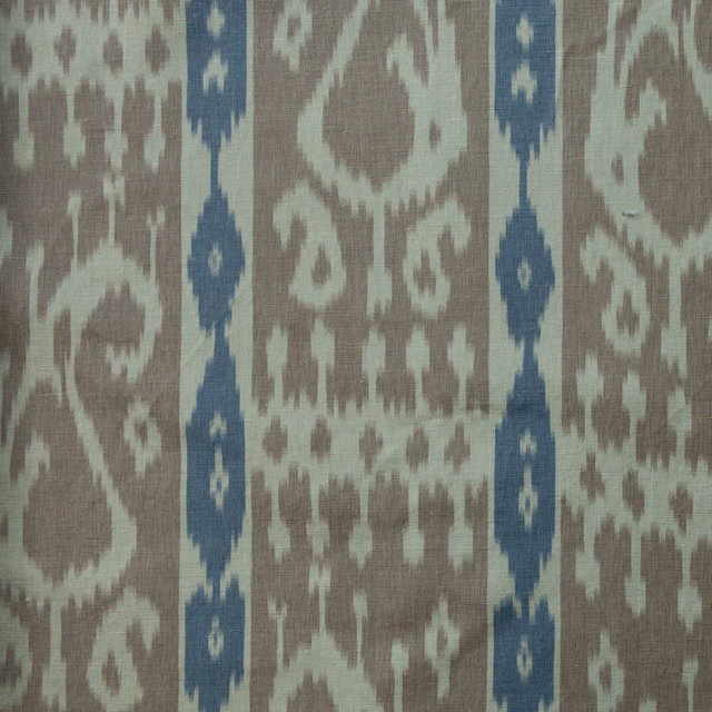 Sienna and navy woven paisley fabric with vertical ikat-style bands