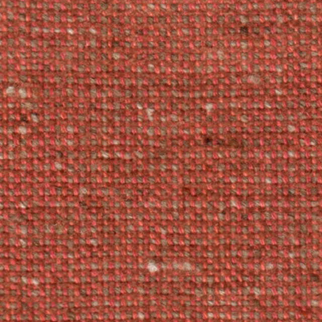 Close-up of a muted rose-red woven fabric with a small nubby texture