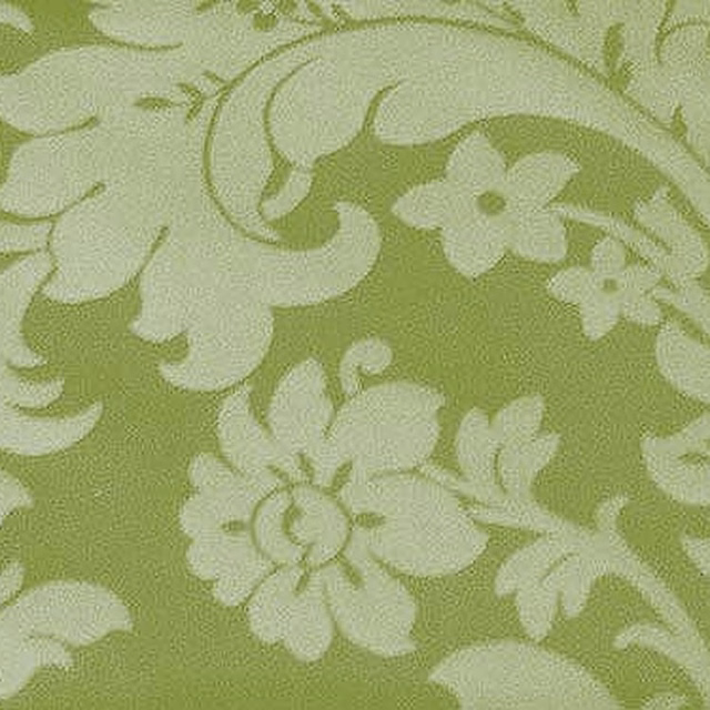 Pale floral woven fabric on a soft lime green ground