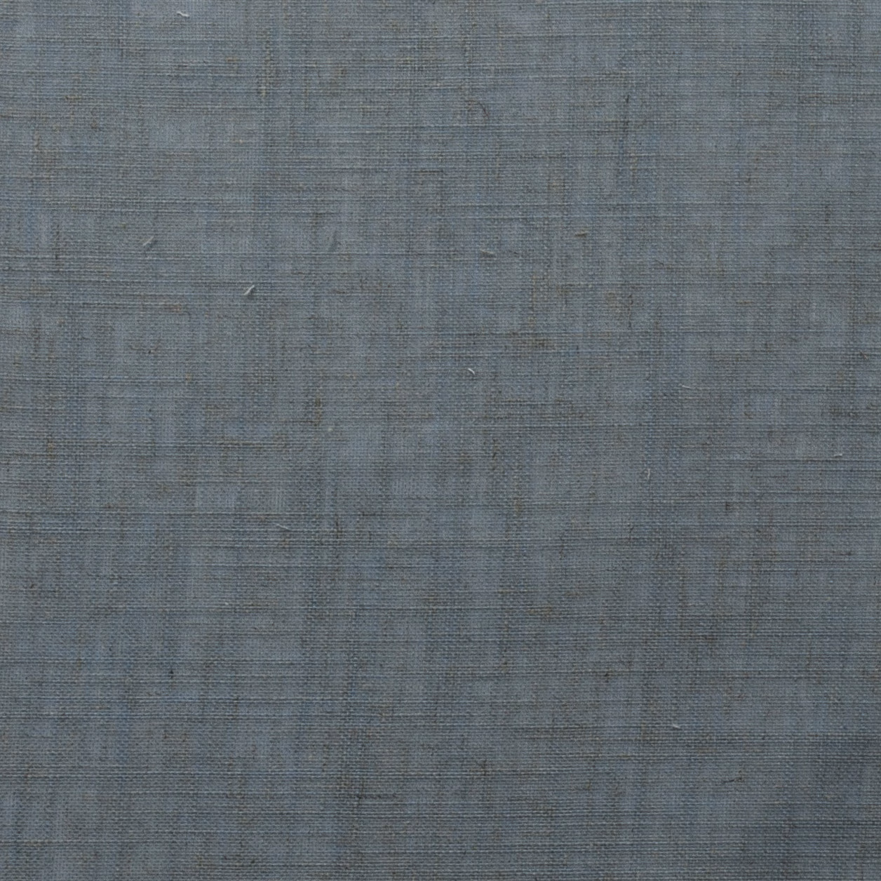 Muted azure blue woven fabric with subtle slubbed texture and tonal variation