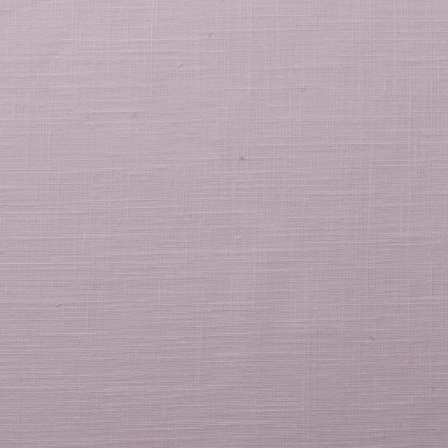 Pale blush pink plain woven fabric with a fine textured surface