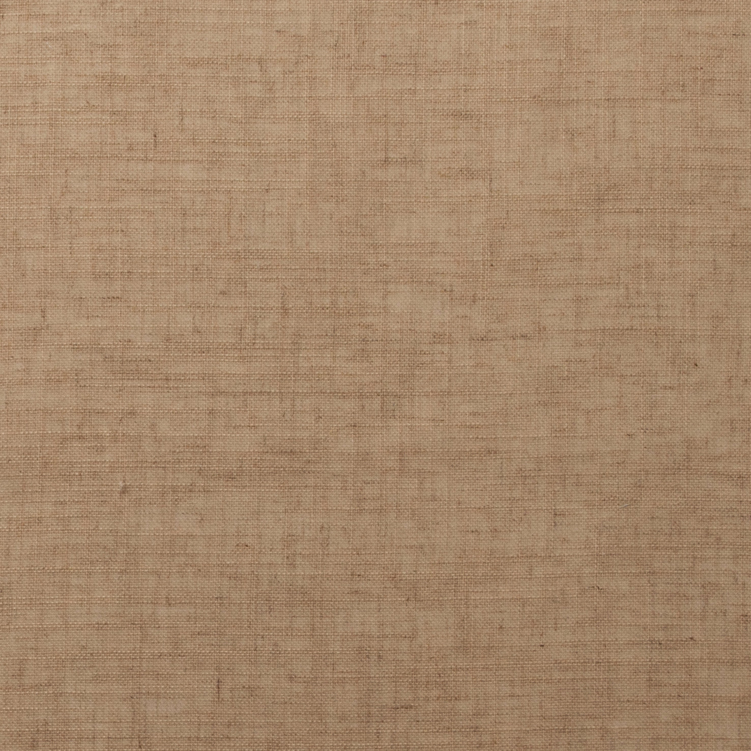 Close-up of warm sandstone beige woven fabric with subtle slubbed texture