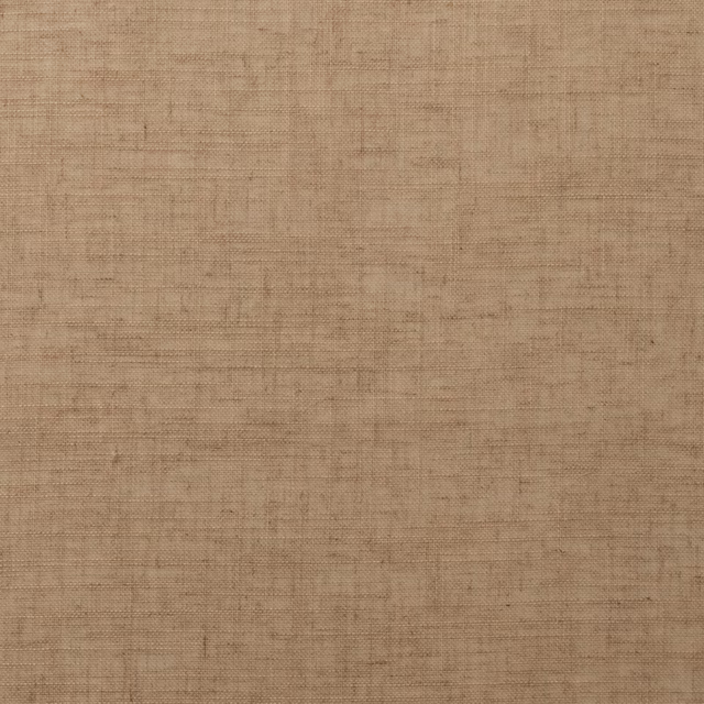 Close-up of warm sandstone beige woven fabric with subtle slubbed texture