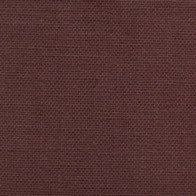 Close-up of deep aubergine woven fabric with a tight, small weave