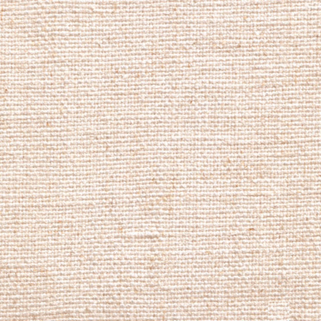 Close-up of a soft warm ivory woven fabric with fine textured grain