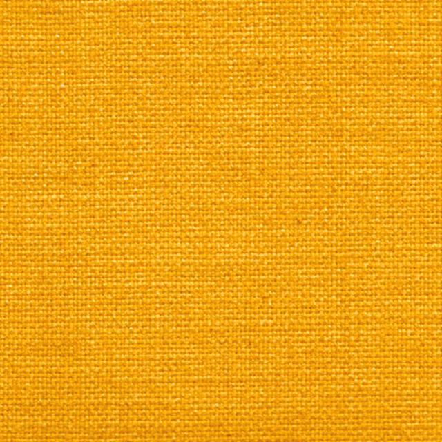 Close-up of a rich mustard-gold woven fabric with fine textured weave
