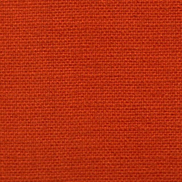 Close-up of a burnt lobster red woven fabric with a tight plain texture