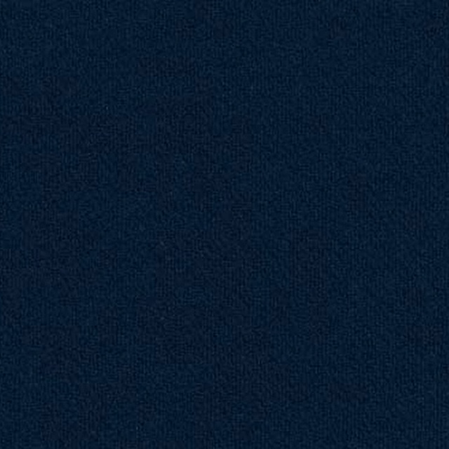 Close-up of deep navy woven fabric with a fine, even texture