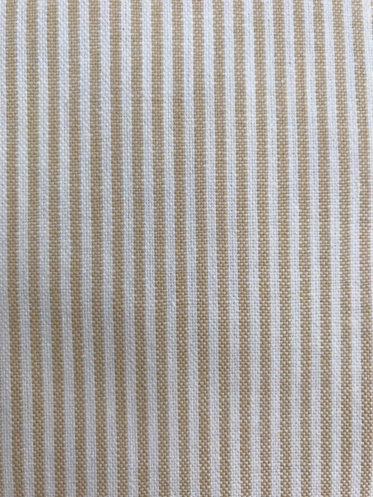 Close-up of a woven fabric with narrow maize-yellow vertical stripes on a pale ground.