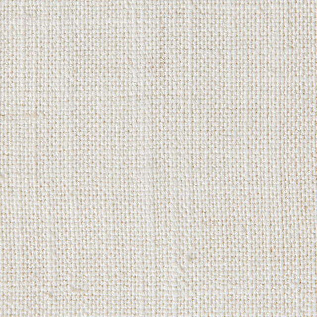 Close-up of warm white woven fabric with fine textured grain