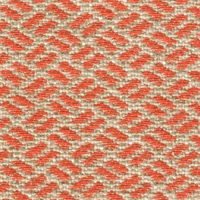 Close-up of a small geometric woven fabric in paprika red and cream