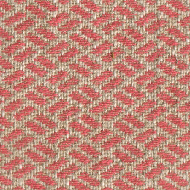 Close-up of a small rose pink and beige woven geometric fabric