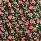 Near-black velvet with vivid pink flowers, green leaves and scattered botanical sprigs
