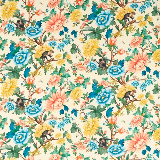 Ivory botanical fabric with coral blooms, blue flowers and perched monkeys