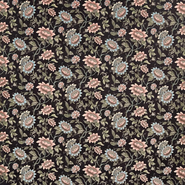 Near-black velvet covered in pink, blue and sage botanical flowers