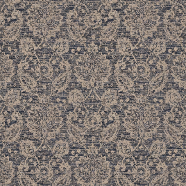 Weathered indigo and taupe woven swatch with distressed floral medallion pattern