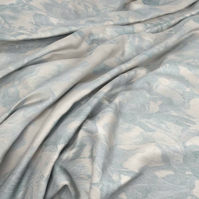 Pale seaglass and ivory botanical fabric with a soft sheen in flowing folds