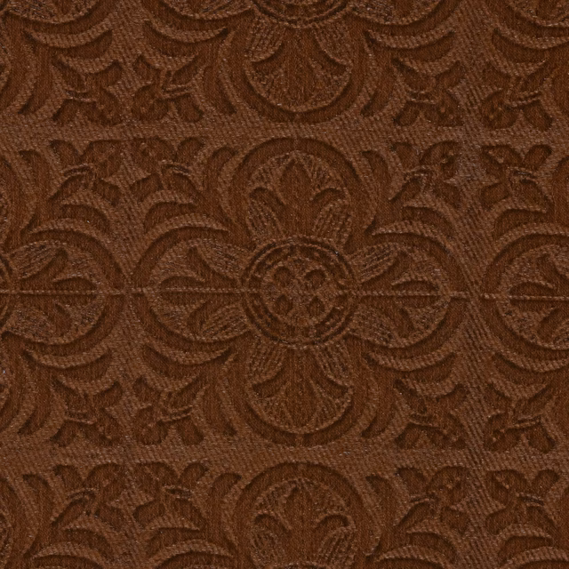 Close-up of warm russet-brown damask with raised medallions and fine woven texture