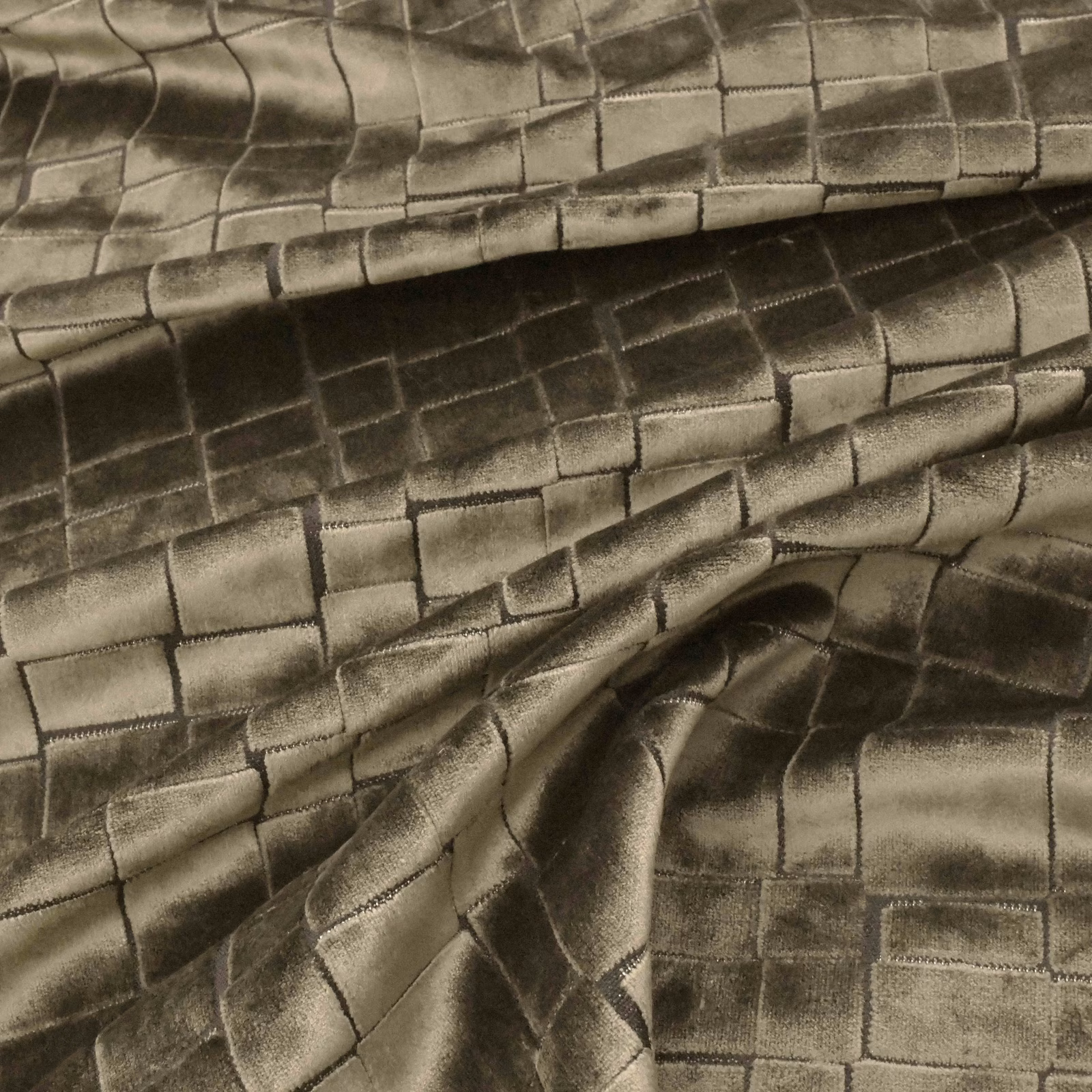 Bronze-brown tiled fabric with olive undertones and lustrous folded texture