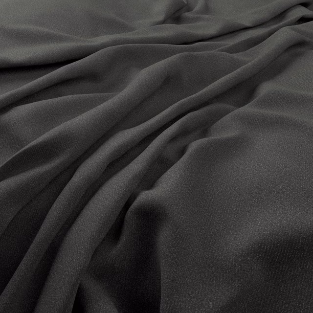 Deep charcoal-grey fine-weave textile falling into softly highlighted fluid folds