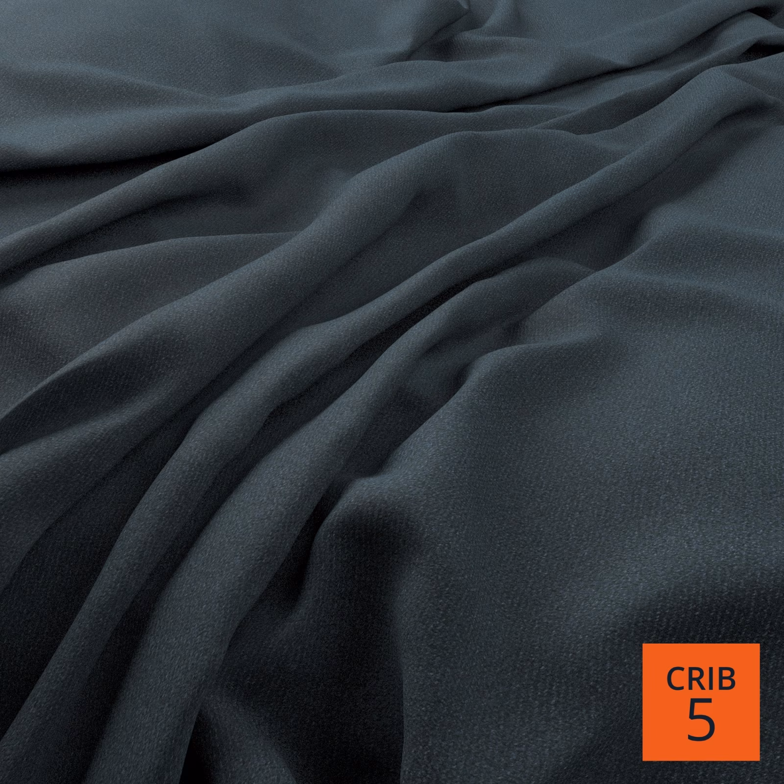 Deep indigo fabric with fine weave and fluid folds catching soft blue-grey light
