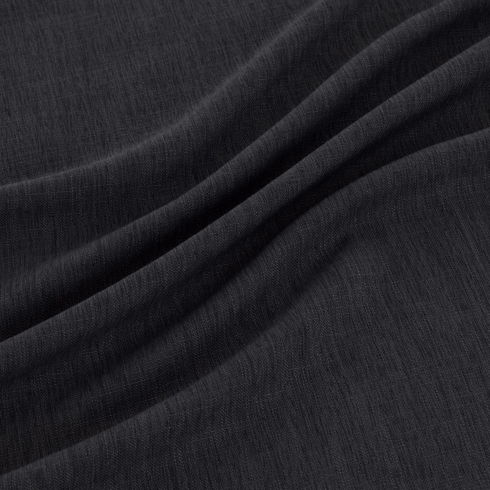Near-black indigo fabric with fine vertical weave falling into soft folds