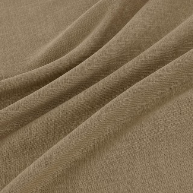 Warm maize-beige woven cloth with fine crosshatch texture falling into soft folds