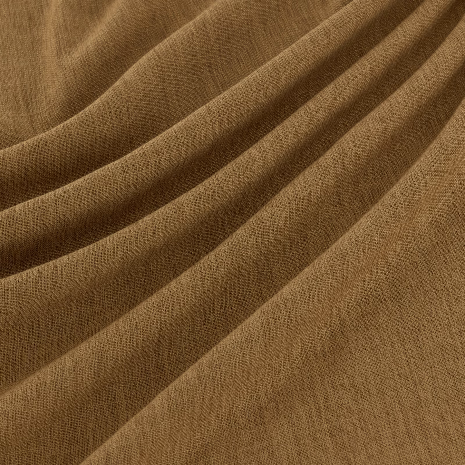 Warm pumpkin-brown woven textile draped in broad folds with fine linear texture