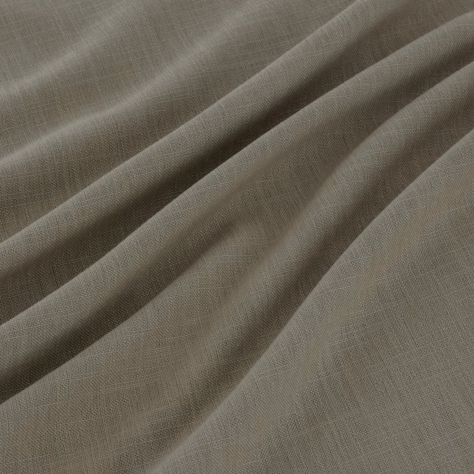 Cool taupe-grey crosshatched weave falling into softly rounded fabric folds