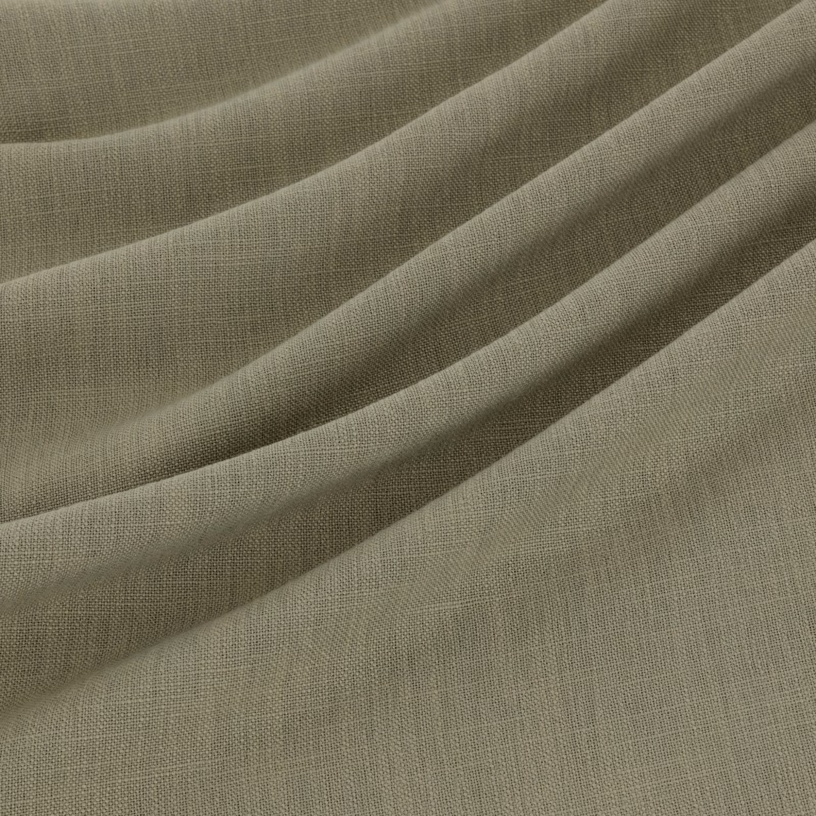 Muted wasabi olive fabric with fine linen-look weave arranged in soft folds