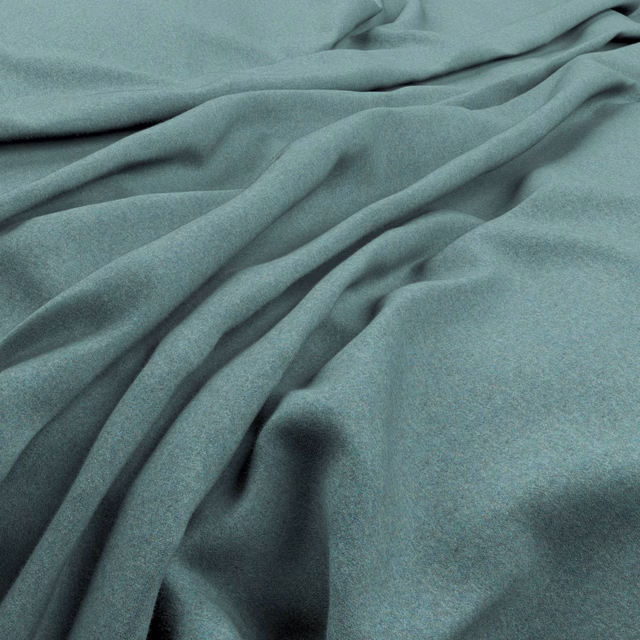 Muted blue-teal fabric in soft folds, showing a fine matte surface and deep shadows