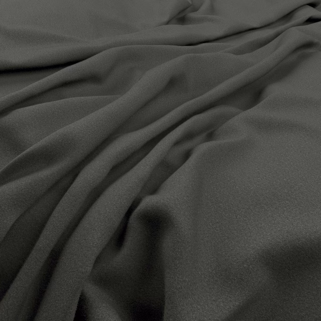 Deep anthracite-grey cloth falling in soft, fluid folds with a fine surface texture
