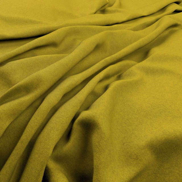 Close-up of vivid chartreuse fabric with soft nap and deep sculptural folds