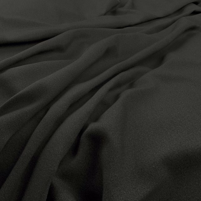 Amatheon Ebony near-black fabric forming soft, fluid folds with subtle charcoal highlights