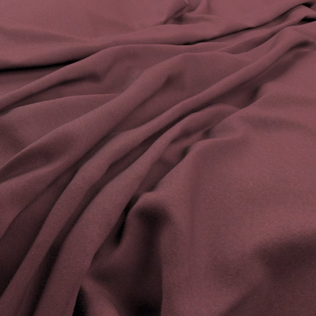 Dusky plum fabric falling in soft, fluid folds with a smooth surface