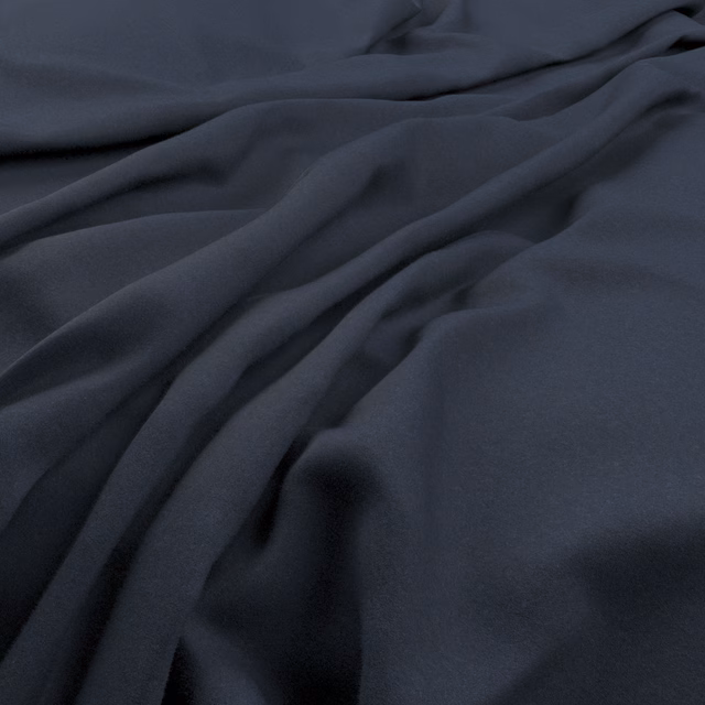 Deep indigo fabric with smooth low-sheen surface gathered into soft folds